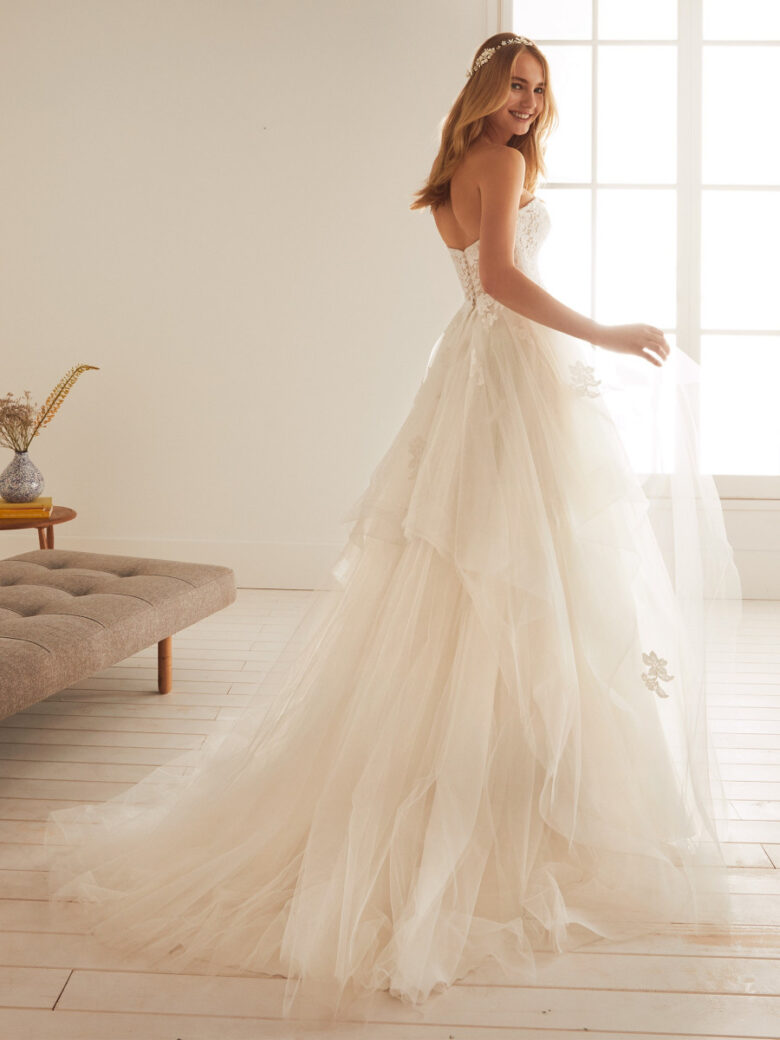 Tall wedding dress with v-neckline and statement earrings